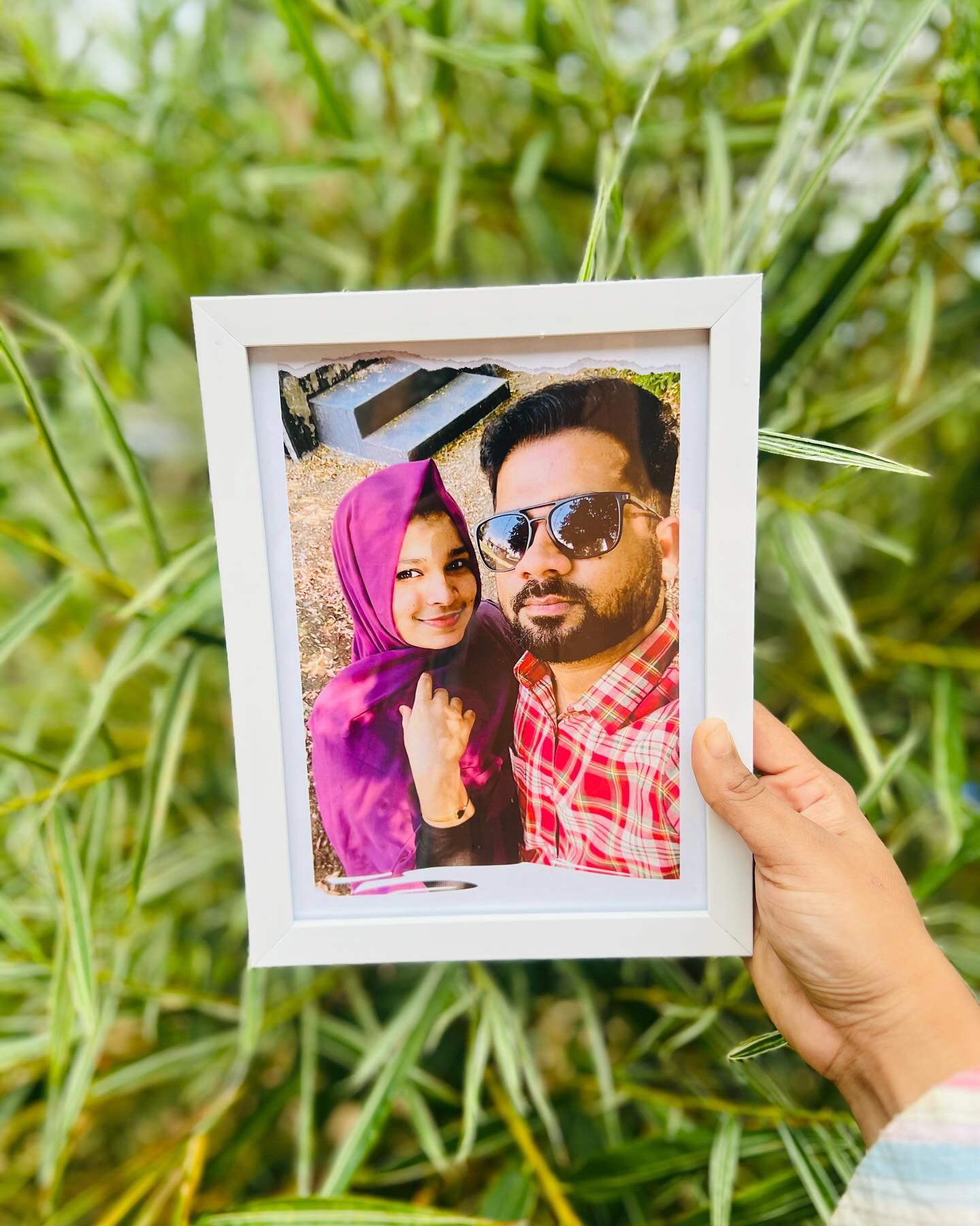 A rustic torn-paper style photo frame showcasing a candid couple portrait, perfect for celebrating a relationship milestone.