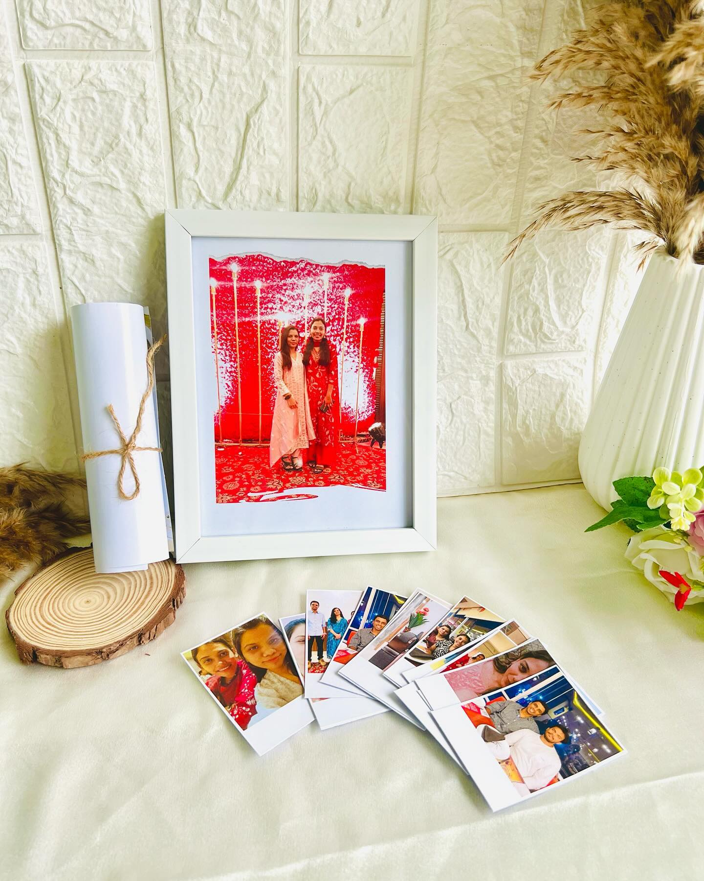 A personalized photo print with a creative torn-paper red backdrop effect, set in a clean white frame.