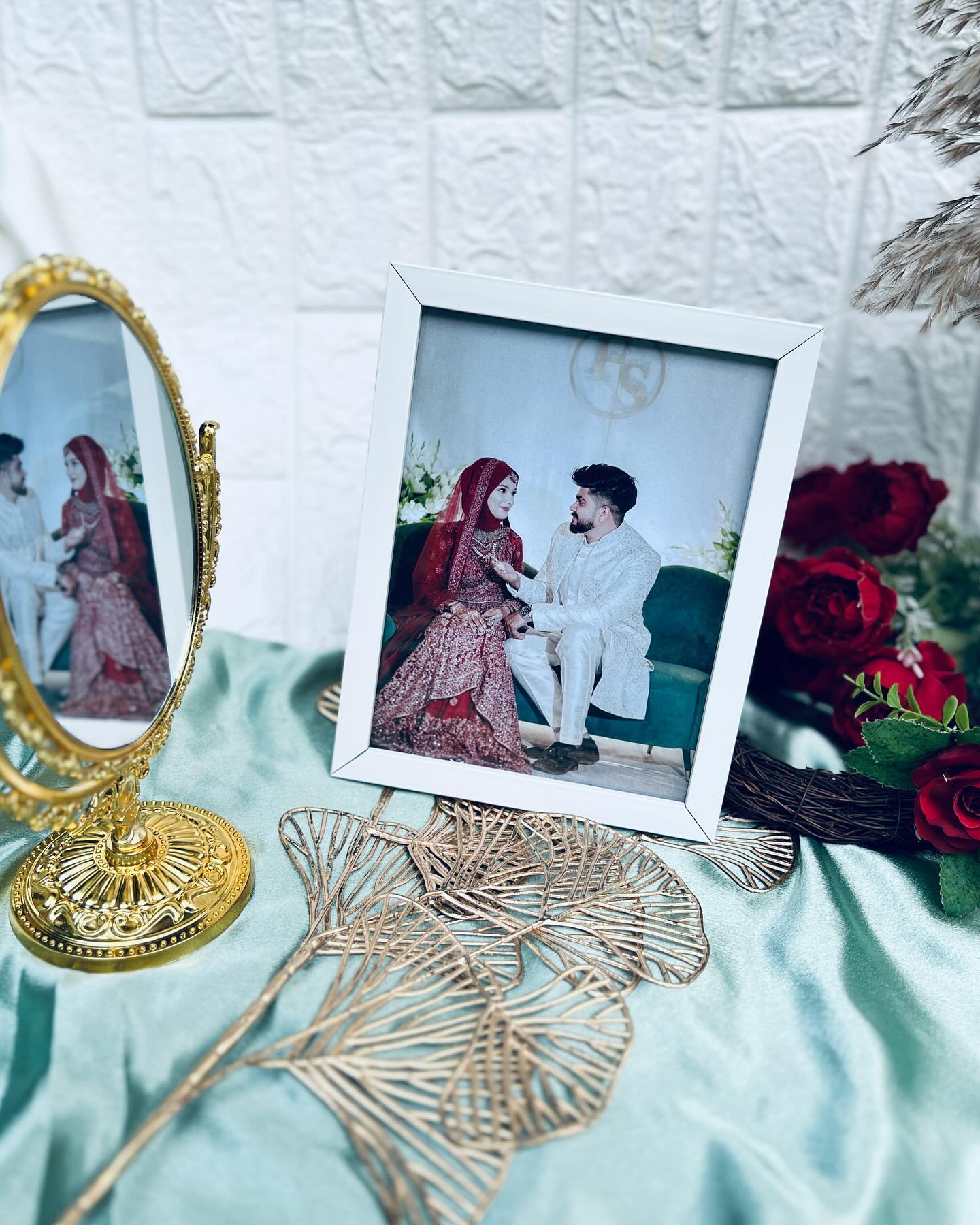 A classic white photo frame showcasing a bride and groom's wedding portrait, a timeless keepsake for newlyweds.