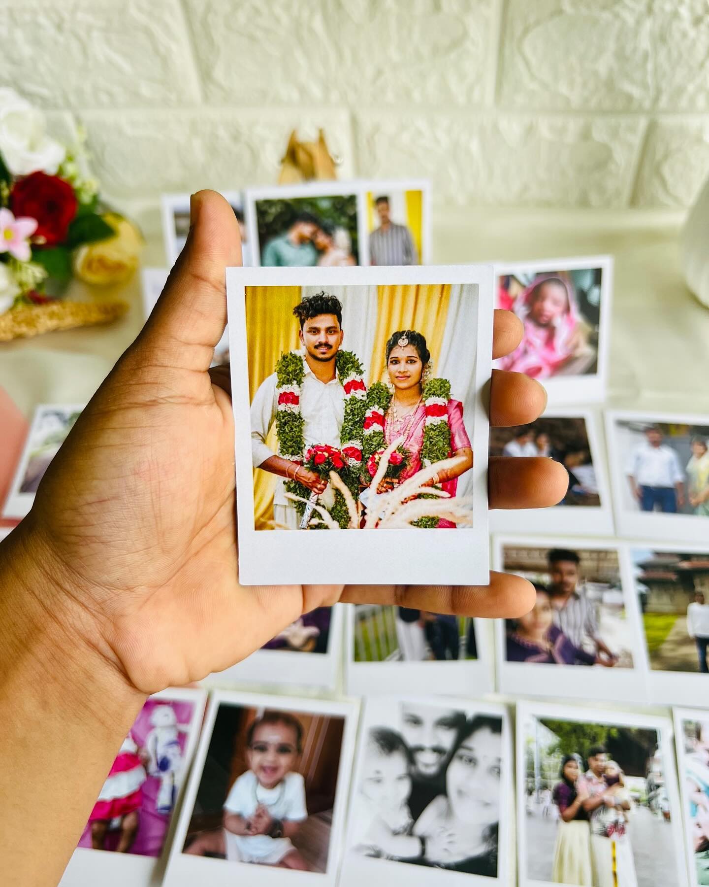 A personalized set of instant-style polaroid prints capturing wedding and family moments.