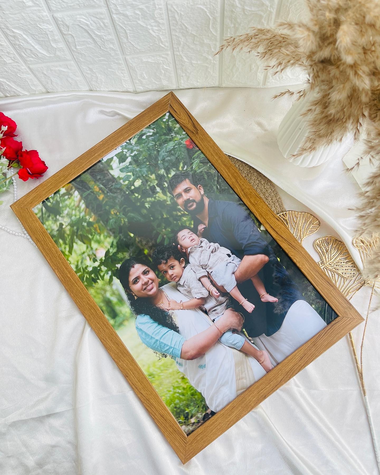 A warm wood-grain frame showcasing a treasured family portrait, ready to gift or display at home.