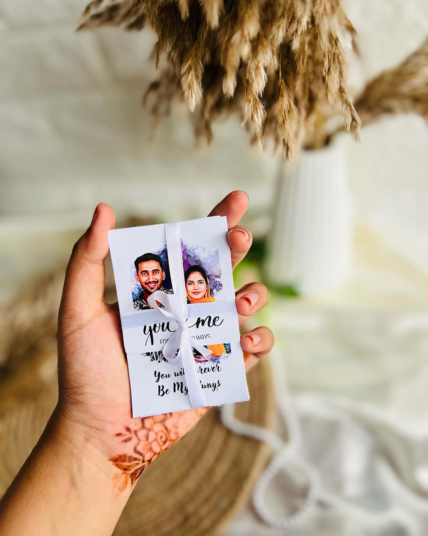 A pocket-sized ribboned keepsake card featuring custom couple caricatures and a heartfelt 'forever' message.
