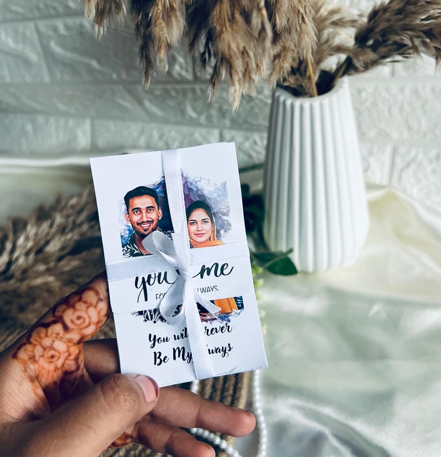 A pocket-sized personalized keepsake card with hand-illustrated caricature portraits of you both and a heartfelt message.